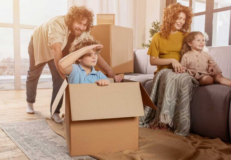 Buyers review a home inspection report and closing documents at a table with house keys nearby.